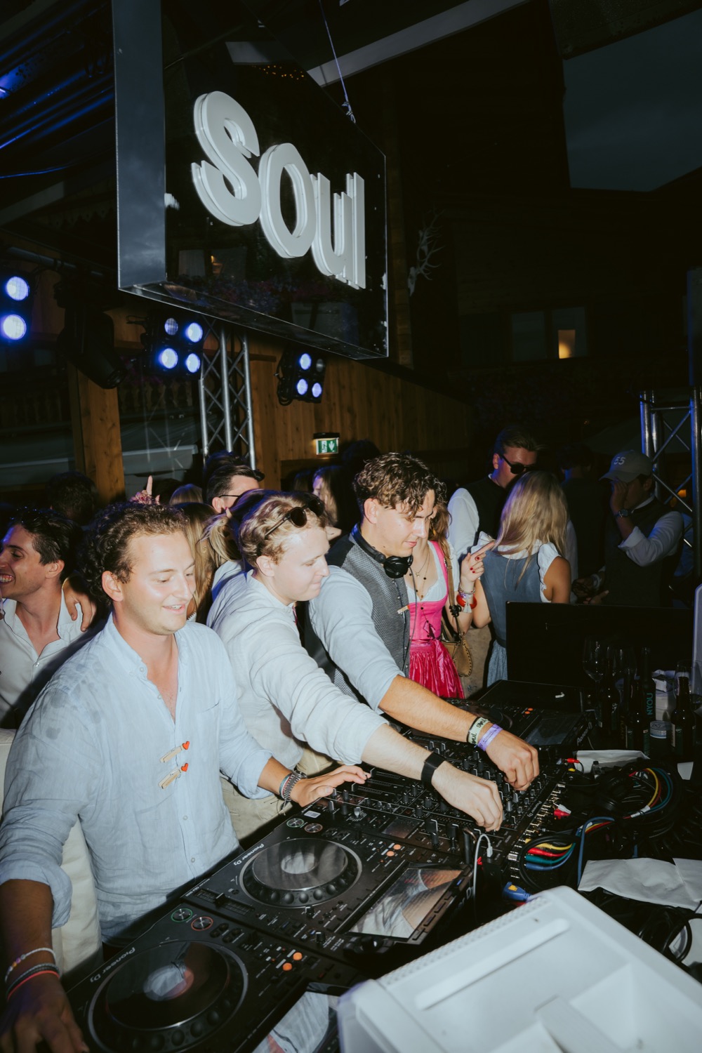 Ben Paul playing behind the decks at night