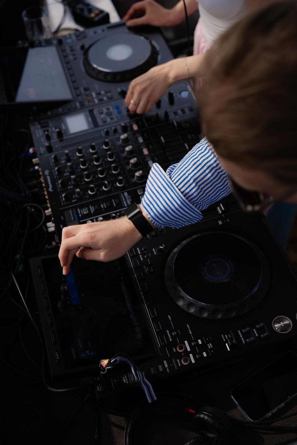 Close-up of Ben Paul mixing on CDJs